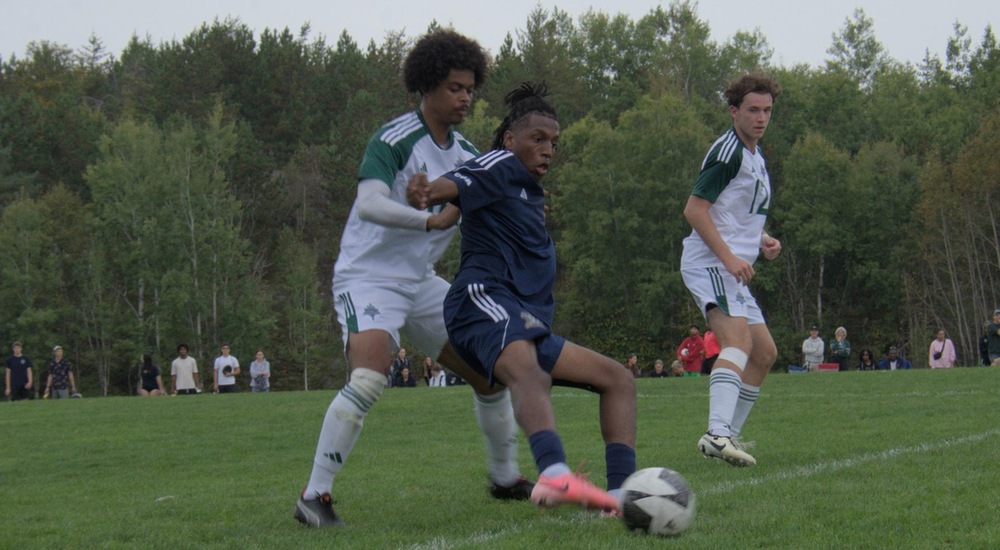 Jaiden Santo battles for ball with Trent defender - Mark Wilson