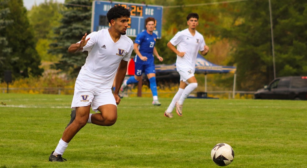 Olly Sankar brings the ball up the field - Tyra Swan