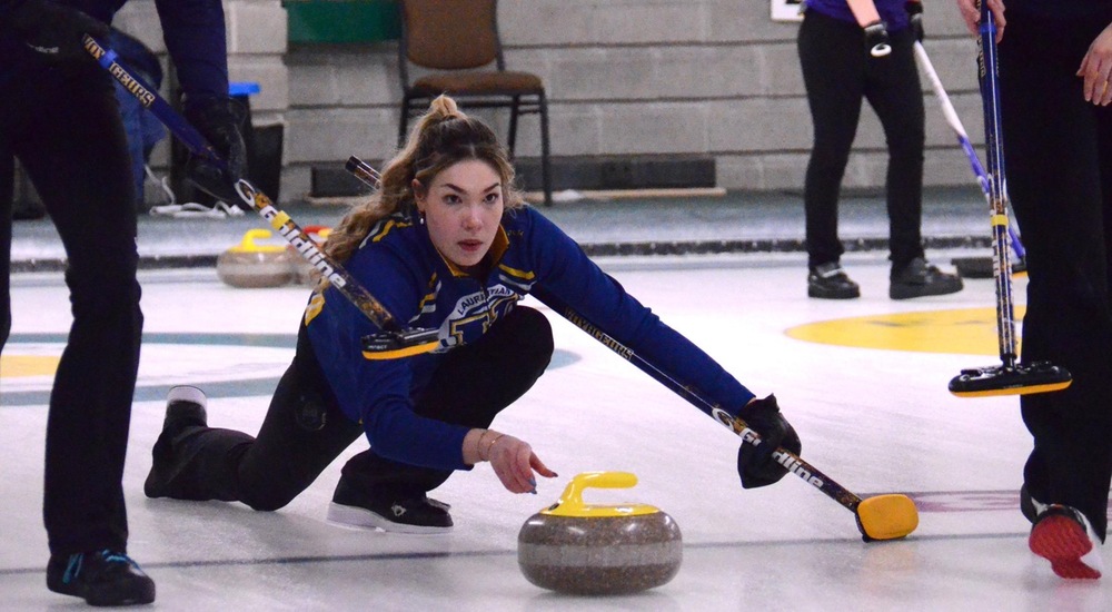 Piper Croisier throwing rock in match against Queen's - Mark Wilson